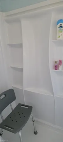 New fiberglass shower with handy shelves