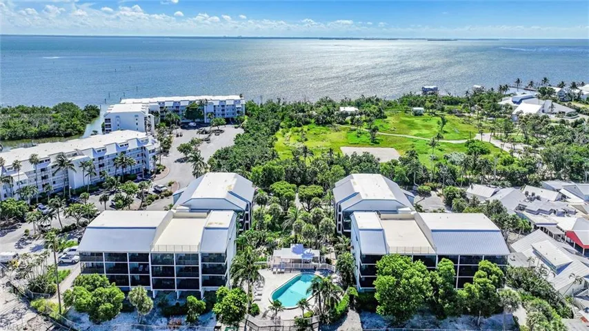 Aerial view of apartment complex / building and a large body of water