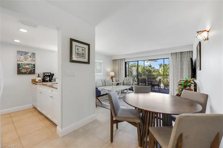 Dining space featuring baseboards and light tile patterned floors