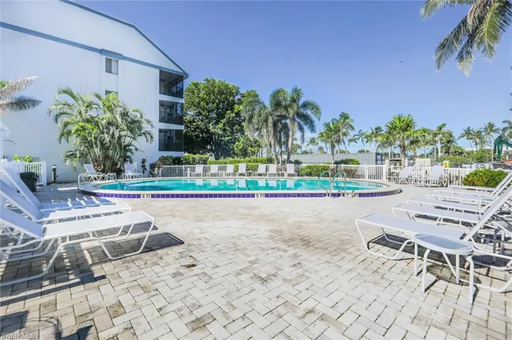 Community pool featuring a patio area