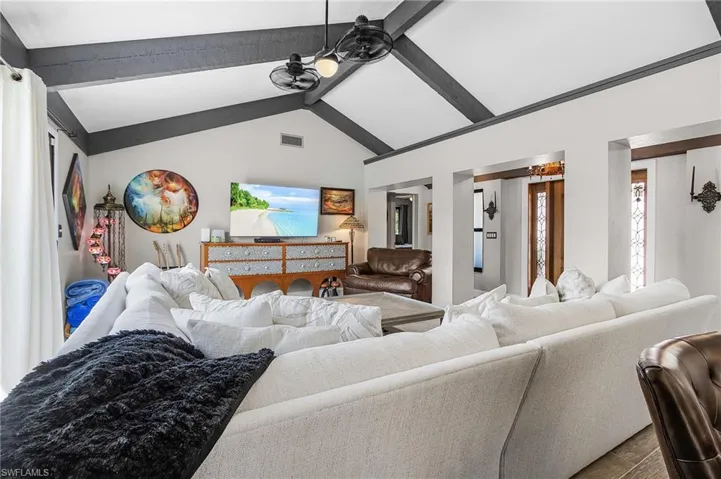 Living room with a ceiling fan and wood finished floors
