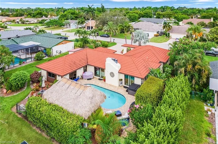 Aerial view of residential area featuring a pool area