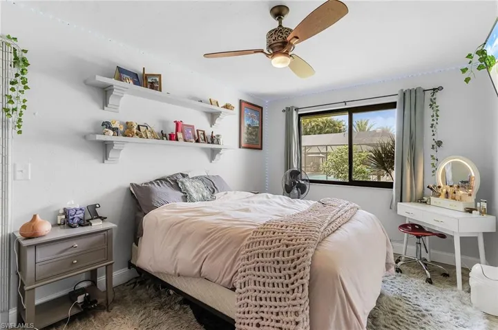 Bedroom featuring baseboards and a ceiling fan