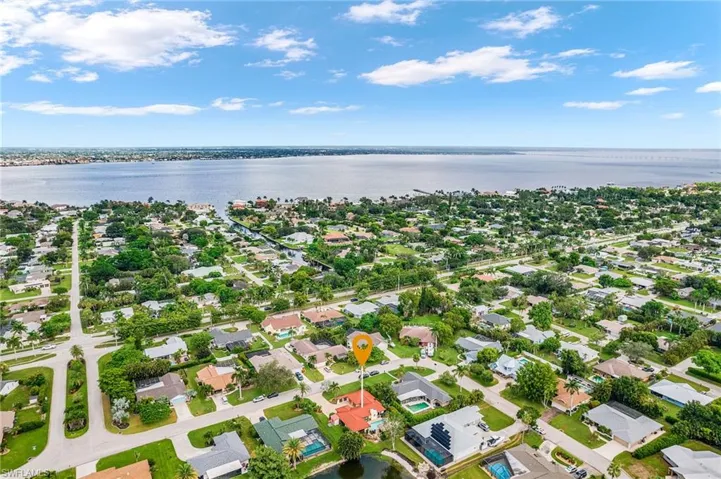 Aerial view of residential area with a nearby body of water