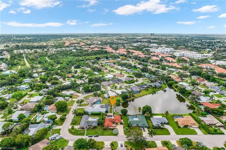 Aerial overview of property's location featuring a nearby body of water