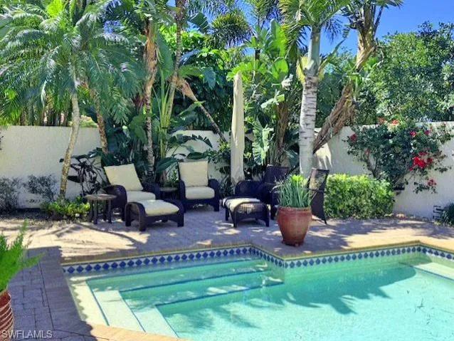 View of pool with a fenced in pool, a patio area, outdoor lounge area, and fence