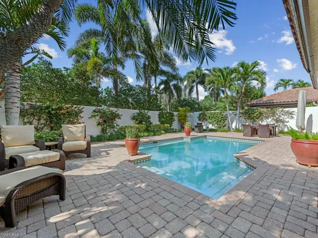 View of swimming pool with a patio and exterior bar
