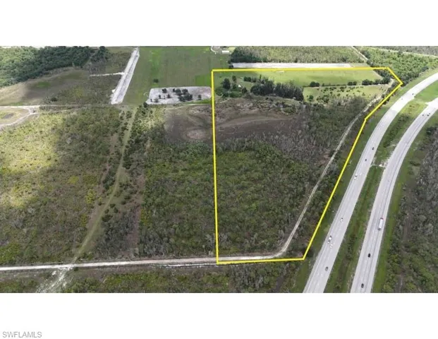 View of rural area featuring a major roadway and property parcel outlined