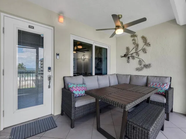 View of patio / terrace featuring a ceiling fan, outdoor dining area, and an outdoor living space