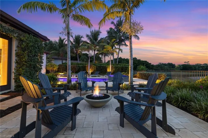 Patio terrace at dusk with an outdoor fire pit