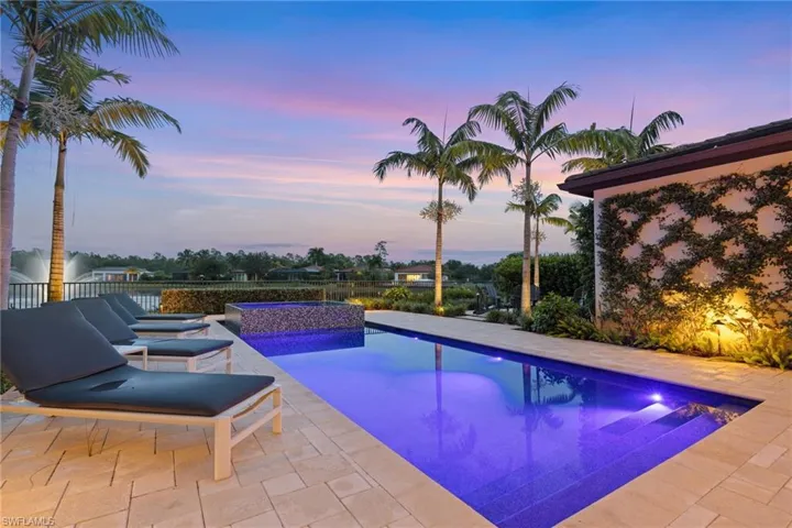 Pool at dusk with a patio