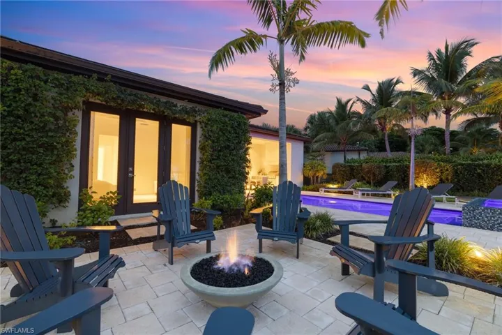 Patio terrace at dusk with a fire pit