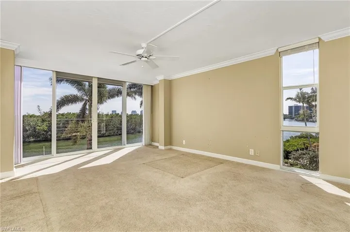 The spacious main bedroom overlooks the bay the bay and the windows provide lots of natural light.