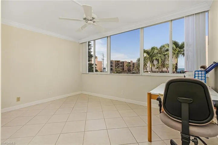 The bedroom on the main level has tile on the diagonal, a closet for overnight guest and extra storage, and a view of Bonita Beach and the Gulf of Mexico.