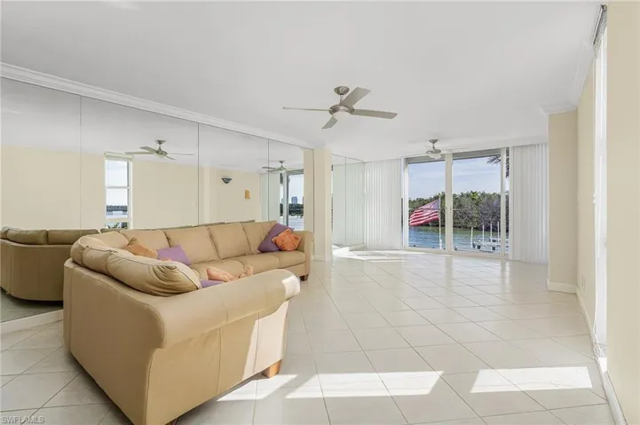 The Living room overlooks the bay where you will enjoy watching all the wildlife and water sports enthusiasts as they boat, kayak & paddle board by in your back yard.