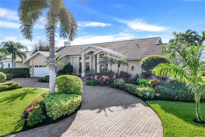 Circular Paver Driveway, Lush Landscaping, Sprinkler System, Welded Ornamental Railing Entry Porch