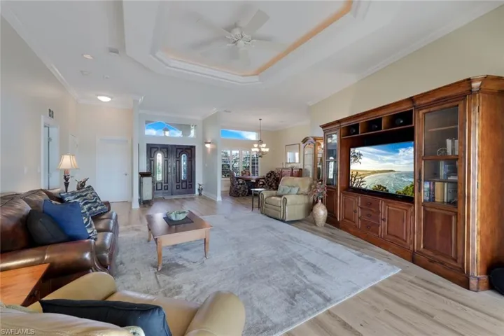 View II of Family Room with Boyer and View into Dining Room