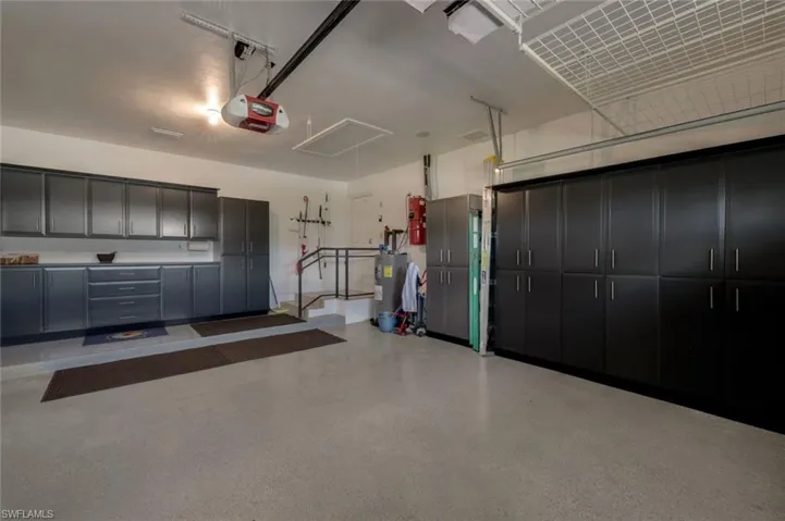 Oversized 2 Car Garage Complete with Work Room Area, Storage, Epoxy Floor, Welded Railings, Top Storage