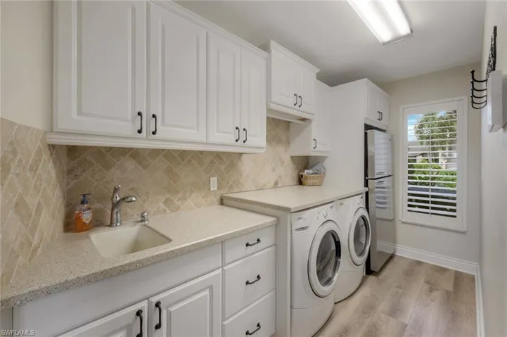 Yes! One Lovely Utility Room- With a Second Full Size Refrigerator, Front Load Washer & Dryer