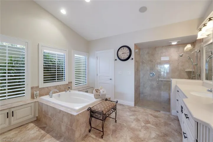 Great Soaking Tub, Privacy Wall Outside, Huge Step In Shower, Door to Water Closet with Storage Cabinets