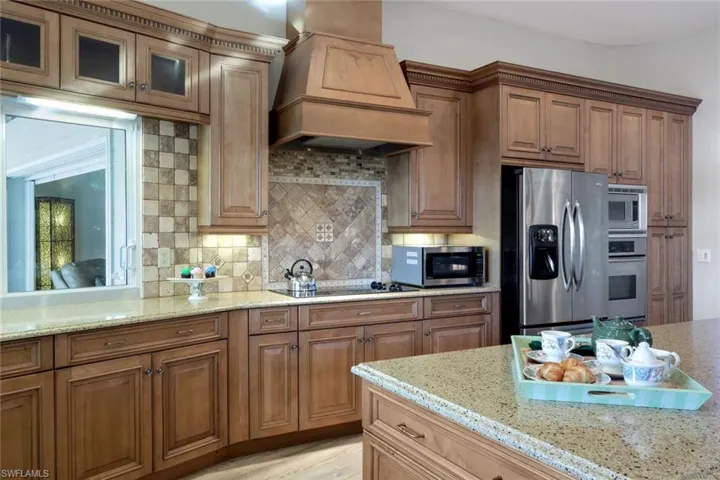 Tumble Marble Back Splash, Hurricane Pass Through Windows, 2 Microwaves, FULLY Stocked with Appliances, Electronic Appliances (not shown), Dishes, Everything for a Fully Operating Household