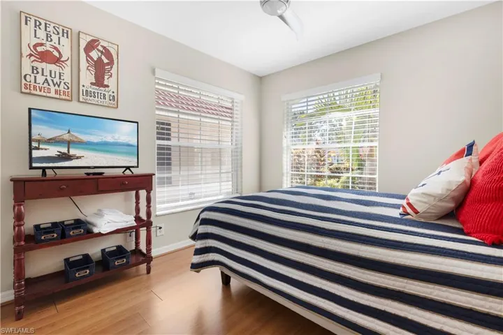 Bedroom #4 featuring light wood-style floors and baseboards
