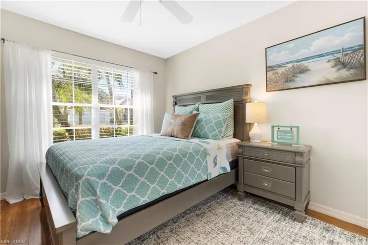 Bedroom #3 featuring wood finished floors and ceiling fan