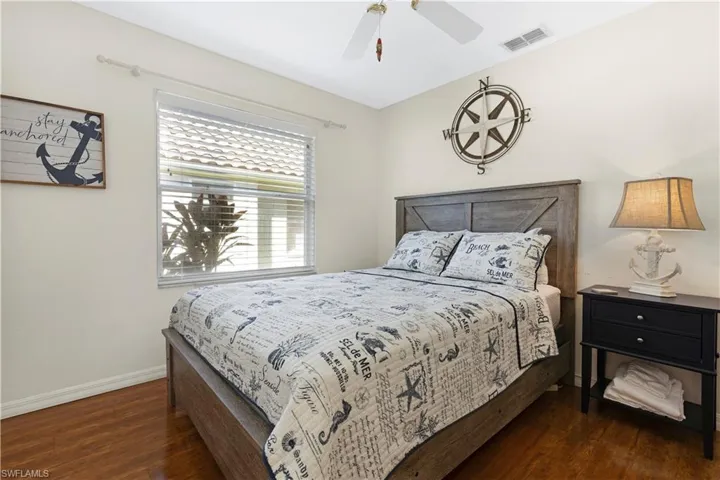 Bedroom #2 featuring dark wood-style flooring and ceiling fan