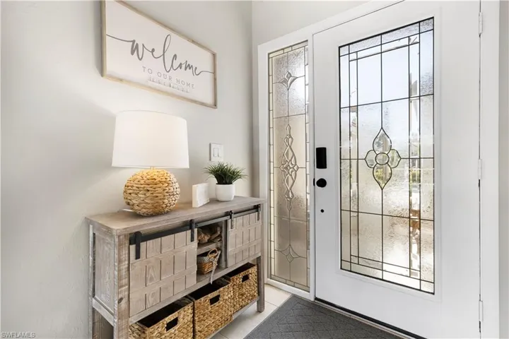 Doorway to outside with tile patterned floors