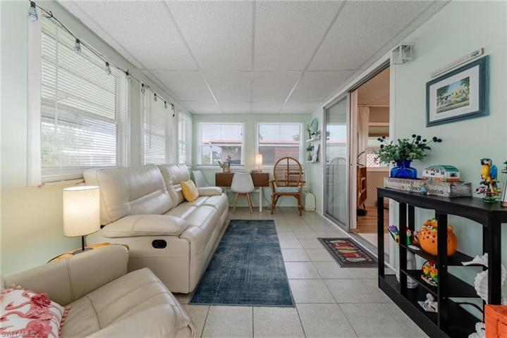 Florida room with door to the front yard.