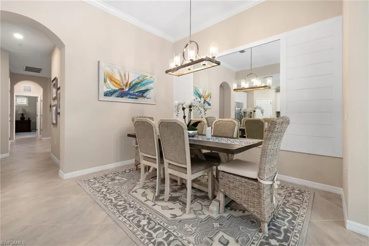 Dining area with Ship lack trim and mirror plus upgraded light fixture