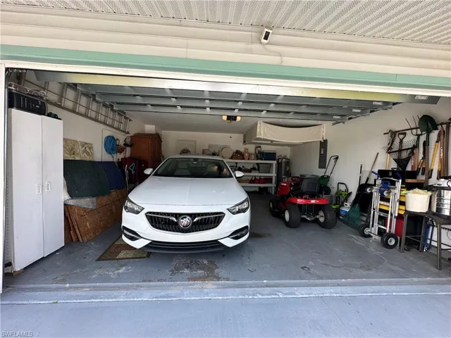 Garage featuring a New Hot water heater & garage door opener