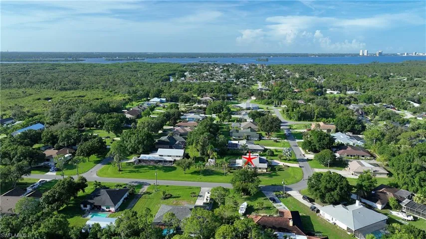 Aerial view of property's location featuring nearby suburban area