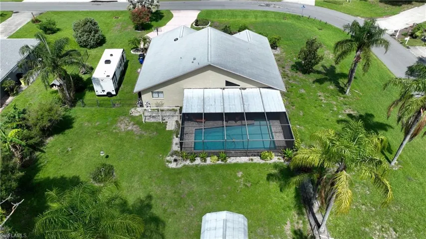 View of subject property with a pool area