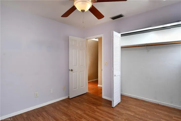 Spare room featuring wood finished floors and ceiling fan