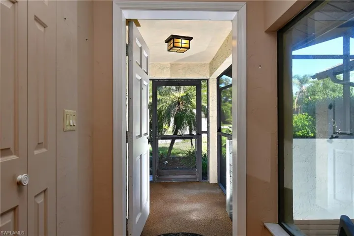 Doorway with carpet flooring
