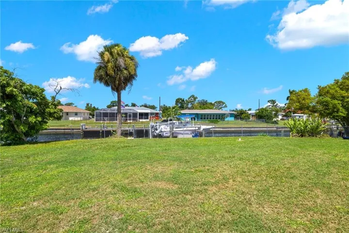 View of yard with a water view