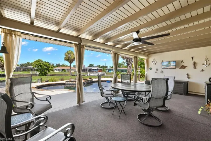 View of patio featuring ceiling fan
