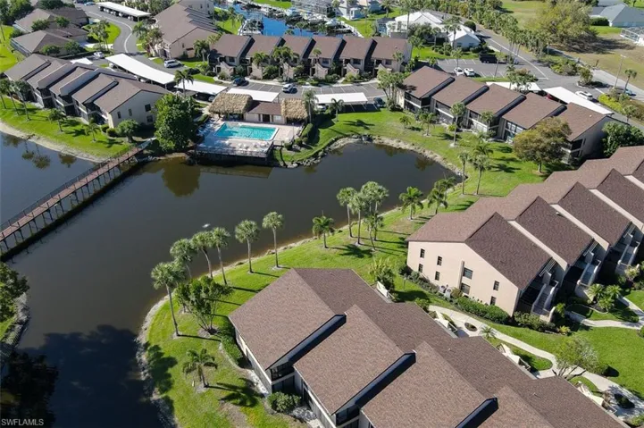 Aerial view of residential area featuring a large body of water