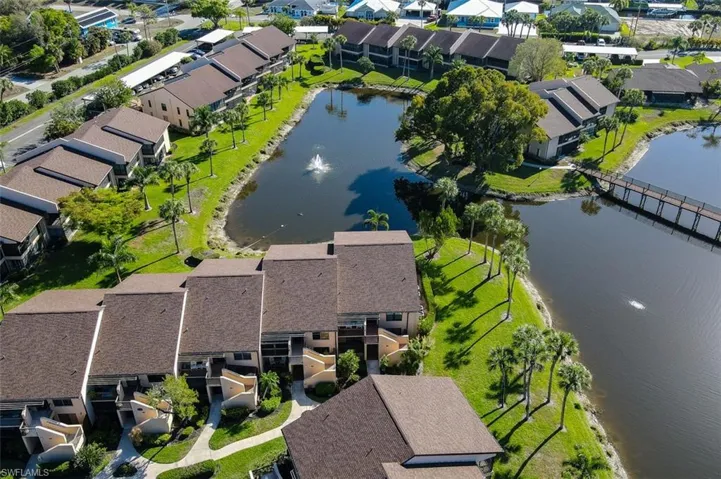 Aerial perspective of suburban area with a large body of water