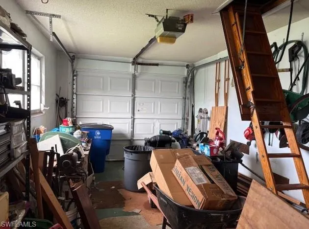 Garage featuring a garage door opener