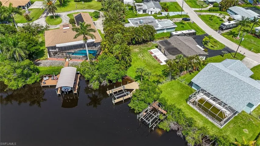 Aerial perspective of suburban area with a large body of water