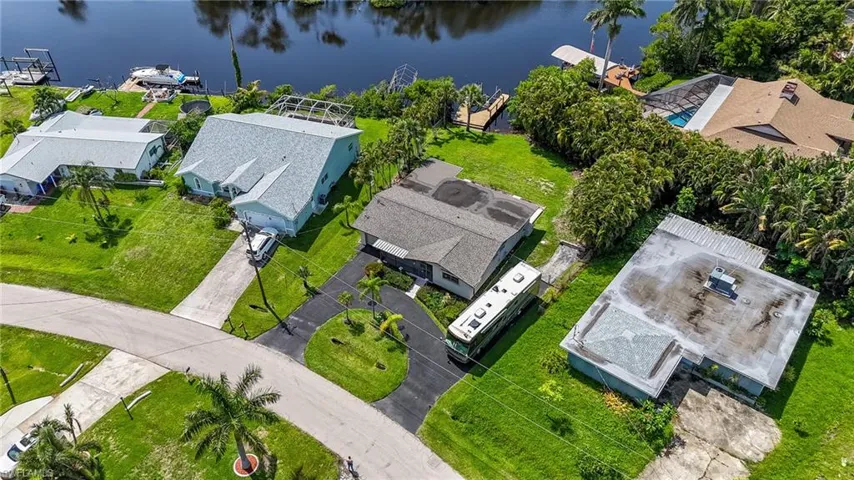 Aerial view of residential area featuring a large body of water