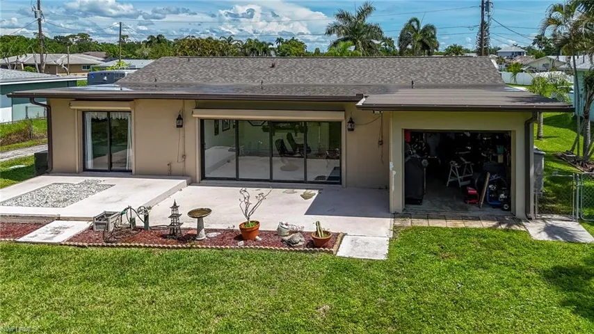 Back of property featuring stucco siding and a patio area