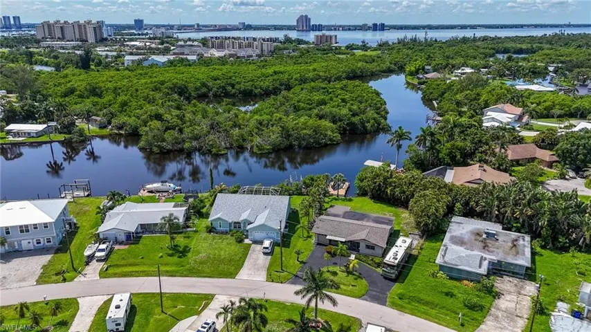Aerial perspective of suburban area with a large body of water