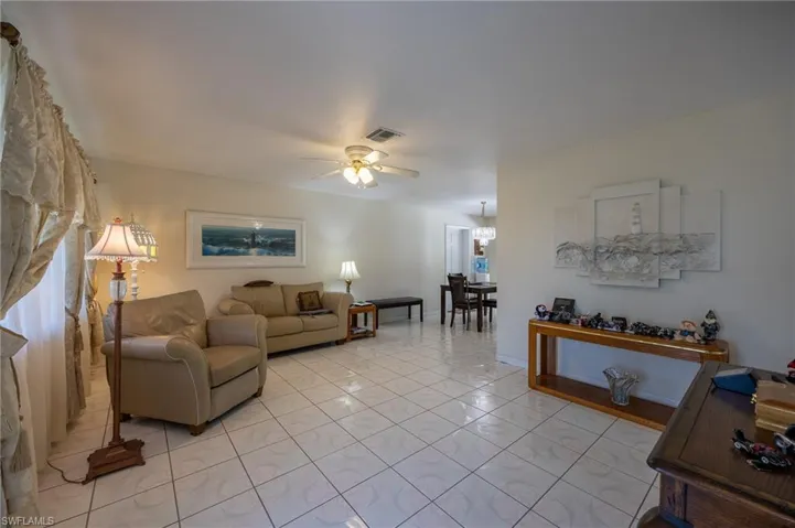 Living area featuring a ceiling fan