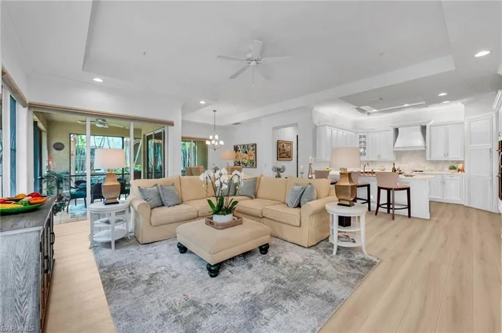 Virtually-stage family with wide-plank wood floors and remodeled kitchen.