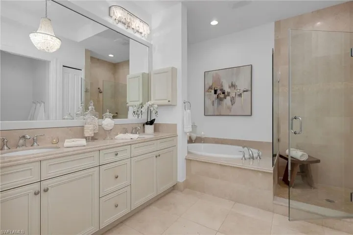 he primary bath has large, walk-in shower with frameless doors, a double vanity, and large linen closet.  Care for a bubble bath after a long day?