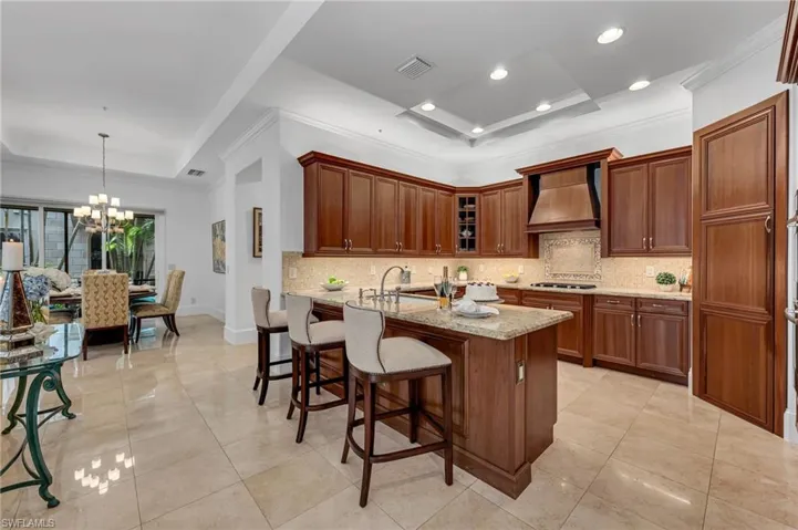 his custom, large kitchen is a dream, with abundant storage, a large, walk-in pantry, and gas range, as Traditions is a natural gas community.