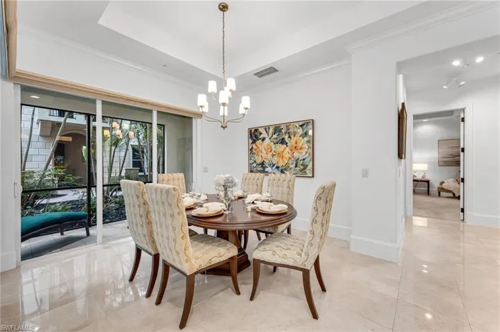 The dining room looks to the large study and Primary Suite.